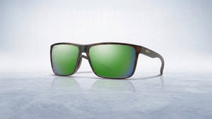 Stylish Smith ChromaPop sunglasses with tortoiseshell frames and vibrant green mirrored lenses on a cool, textured background.