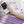 Hand holding UTK heating pad controller with auto off timer and overheat protection icons