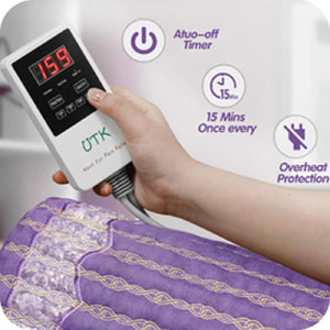 Hand holding UTK heating pad controller with auto off timer and overheat protection icons