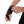 Person adjusting a black wrist brace with a BOA dial closure system