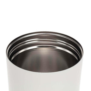 Top view of a stainless steel bottle opening with visible screw threads