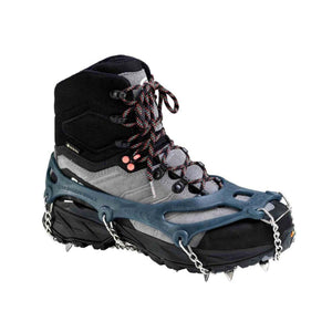 Snowline Chainsen Walk traction spikes attached to a grey and black hiking boot