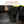 Trex stretchable rubber ice cleat being pulled over a work boot