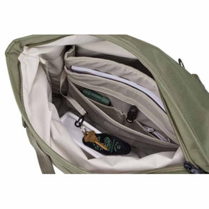 Interior view of an olive green tote bag with organized pockets and a key clip