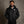 Man wearing a black ActionHeat Pittsburgh Steelers heated jacket