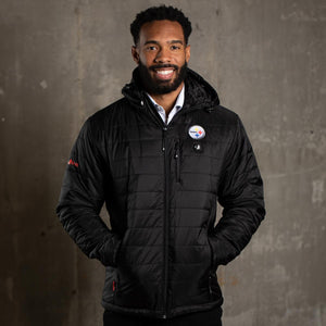 Man wearing a black ActionHeat Pittsburgh Steelers heated jacket