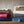 Stacked Woolrich heated blankets in various colors with a digital controller