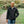 Man wearing a black ActionHeat heated jacket outdoors