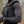 Person wearing a 221B Tactical black police vest and long sleeve shirt