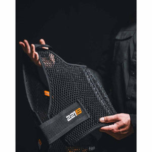 Person holding black 221B Tactical mesh vest liner