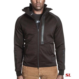 Man wearing a black 221B Tactical zip up jacket with chest and sleeve pockets