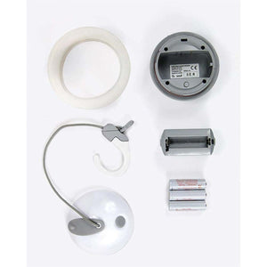 Disassembled Snow Peak Hozuki lantern components including battery pack and batteries