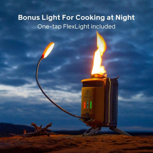 BioLite camp stove with a lit flame and attached flexible LED FlexLight at night