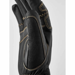 Close up of Hestra black leather glove with contrast stitching