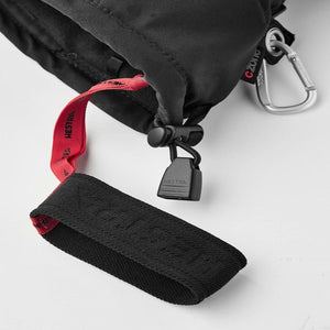 Hestra glove cuff detail with red pull tab and black cord lock
