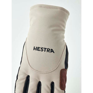 Hestra beige glove with black accents and logo