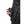 Hand holding a 30seven battery pack connected to a black quilted vest