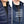 Two close up views of a 30seven thin navy blue jacket worn under other clothing