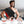 UTK Technology red light therapy wrap worn across the shoulder with inset images showing back neck and shoulder use