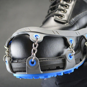 Winter Walking ice cleat traction device attached to a black work boot