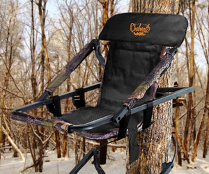 Chaheati Max tree stand seat with camo frame and black headrest mounted to a tree in a winter forest