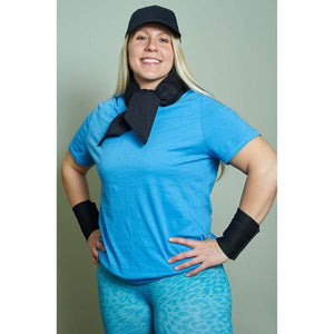 Person wearing Polar Products black cooling neck wrap and wrist bands with blue shirt and cap