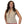 Woman wearing a beige zip front vest over a mauve top