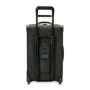 Back view of a black Briggs and Riley rolling suitcase with extended handle