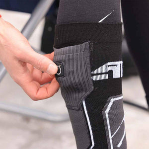 Hand adjusting power button on 509 heated sock