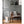 Vornado humidifier emitting mist on a wooden floor next to a grey armchair