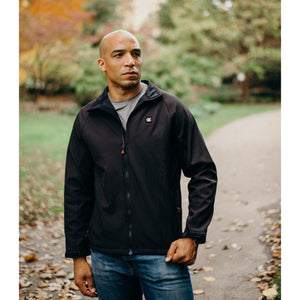 Man wearing a black ActionHeat softshell jacket outdoors