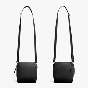 Front and back view of a black Bellroy crossbody bag with adjustable strap