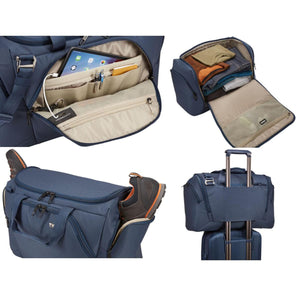Thule blue duffel bag showing interior pockets, packed clothes, shoe compartment, and luggage handle pass-through