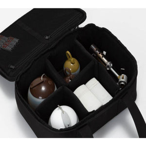 Snow Peak black storage case with internal dividers containing camping lanterns and a torch