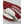 Close up of a red and white Hestra glove with white leather palm detail