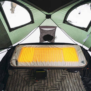 Ignik heated sleeping pad inside a tent with visible heating coils