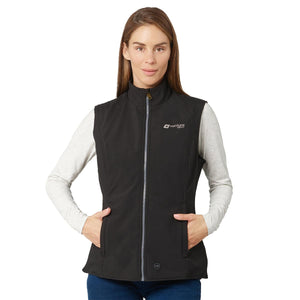 Woman wearing a black Venture Heat softshell vest over a grey long sleeve shirt