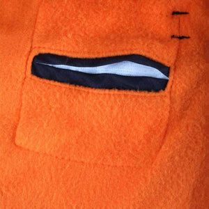 Close up of orange fleece fabric with a black welt pocket detail