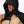 Man wearing a black and tan Mobile Warming hooded jacket with drawstring pulled