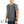 Mobile Cooling quilted grey vest on a model wearing a grey t-shirt and jeans