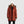 Outdoor Research rust colored hooded down parka with faux fur trim and white beanie