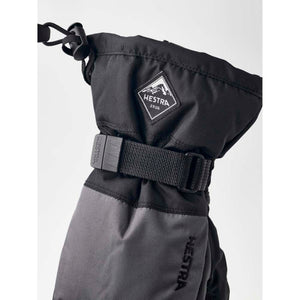 Hestra black winter mitten with adjustable wrist strap and Hestra logo patch