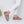 SnugToes taupe faux fur slippers worn with white trousers