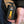 Mobile Warming battery pack with power indicator lights held in a hand