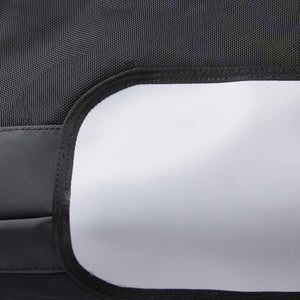 Close up of black textured fabric panel with a smooth white reflective strip