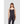 Woman wearing a black spaghetti strap camisole with textured fabric