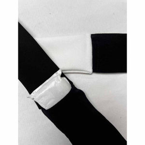 Oro Sports black and white fabric strap with a small white rectangular pouch