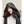 Person wearing a black Kelvin hooded vest with adjustable drawstrings
