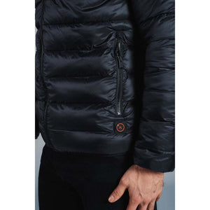Close up of black quilted puffer jacket with zippered pocket and orange circular logo patch