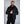 Man wearing a black 8K FlexWarm hooded puffer jacket